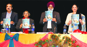 University of Jammu Vice Chancellor Mohan Paul Singh Ishar releases the souvenir of the conference and MELUS-MELOW Journal in Jammu on Friday.