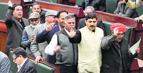 BJP MLAs walk out of the J-K Assembly on Friday.
