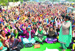 Members of the Anganwadi Employees Union stage a protest near the Mini-Secretariat in Ludhiana on Friday.