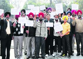 Members of the Amritsar Vikas Manch hold a protest at Company Bagh in Amritsar on Saturday