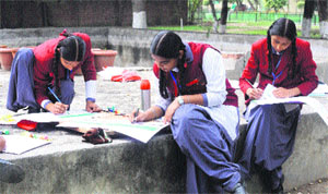 Students busy in poster-making competition at CUP in Bathinda on Saturday.