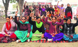 Multipurpose Health Workers stage a protest at the Civil Hospital in Bathinda on Saturday.