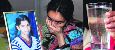 (Right) A sample of water from GH-1, MDC, Panchkula. (Left) The inconsolable mother with the photograph of the deceased girl.