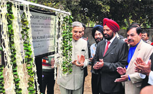MP Pawan Bansal inaugurates the Solar Cycle Stand at Government Model School-46, Chandigarh, on Saturday.