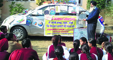 Jaswinder Singh conducts practicals for students in Patiala.