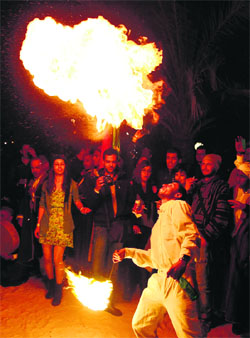 A man plays with fire during the opening ceremony of Electronic Music Festival in Tunisia on Friday.