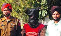 The arrested accused in police custody in Bathinda on Sunday. a tribune photograph
