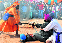 Gatka players perform martial art during the Rose Festival in Chandigarh on Sunday