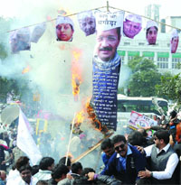 Congress activists burn an effigy of former Chief Minister and AAP chief Arvind Kejriwal during the launch of the partys Pol Khol campaign in New Delhi on Sunday.Tribune photo: Manas Ranjan Bhui