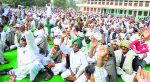 Khap leaders and members of Jat community participate in the mahapanchayat at Danoda village in Jind on Sunday.