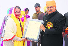 Speaker Kudeep Sharma felicitates a woman at the founder's day function of Guru Nanak Khalsa College in Yamunanagar on Sunday. 