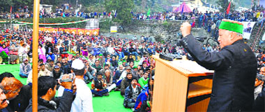 Chief Minister Virbhadra Singh addresses a public meeting at Kandaghat on Sunday.