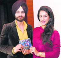 Lead actress Sameksha Singh and actor Nav Bajwa at the music release of the upcoming Punjabi film Fateh in Jalandhar. Tribune Photo : Malkiat Singh