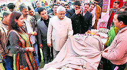 Minister for Planning, Labour and Employment Ajay Sadhotra inspects a stall during the employment fair at Marh in Jammu on Sunday