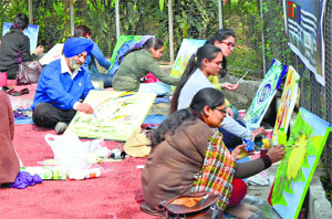Artists of ARS Group take part in a spot-painting workshop at Punjabi Bhawan in Ludhiana on Sunday.