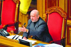 Newly-appointed interim President Olexandr Turchynov gestures while speaking during a session in Kiev on Sunday