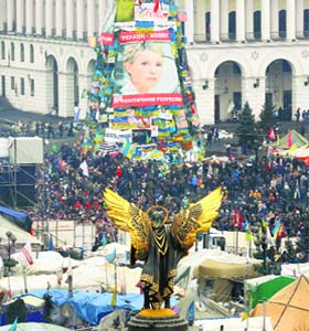 A poster of freed opposition leader Yulia Tymoshenko is seen at the Independence Square in Kiev on Sunday