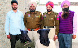 The two murder accused in police custody in Bathinda on Monday.