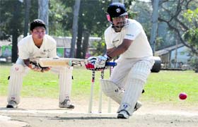 A batsman plays a shot in the District Cricket League at OFD Ground in Dehradun on Monday
