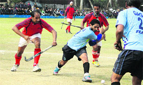 ITBP and Amrit Sports Club play in a semi-final match during the second day of the Sansarpur Hockey Cup in Jalandhar Cantt on Monday.