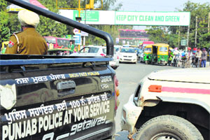 Police erect a barricade of vehicles to divert the traffic