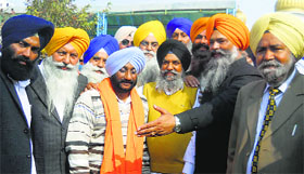 SAD nominee Kulwant Singh (having siropa) with supporters in Fatehgarh Sahib on Monday.