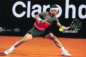 Rafael Nadal outclassed Alexandr Dolgopolov 6-3 7-6 to win the Rio Open on Sunday.