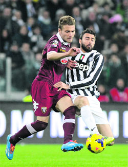 Juventus Andrea Barzagli (right) challenges Torinos Ciro Immobile for the ball during their Serie A match in Turin on Sunday. 