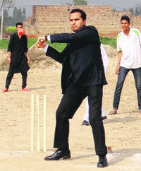 Deputy Commissioner KK Yadav showcases his cricketing skills during the Mainauna Cricket Tournament in Bathinda on Tuesday.