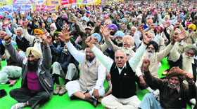 Members of the Punjab Government Pensioners Association shout slogans against the state government in Bathinda.