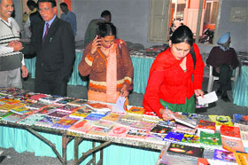 Teachers of government schools select books at an exhibition in Bathinda on Tuesday.
