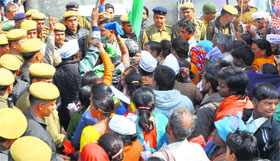 Residents of Ashiana flats hold a protest in Panchkula on Tuesday.