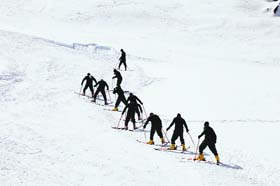 Chilling challenge: Skiers participate in a practice session at Auli in Chamoli district on Tuesday ahead of Winter Games