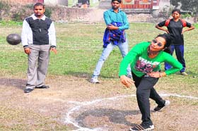 A girl student throws a shot put during the annual sports meet at Shravan Nath Jawaharlal Nehru College in Haridwar on Tuesday