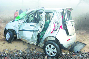 The ill-fated car that met with an accident with a goods train at an unmanned railway crossing near Suchan village in Sirsa.