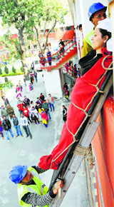 NSS volunteers and civil defence personnel hold an exercise in disaster management on the premises of Government College for Women, Parade, in Jammu on Tuesday.