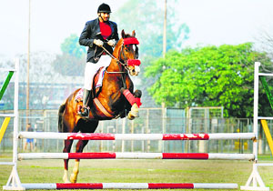 An NCC volunteer takes part in an equestrian event during the annual athletics meet at GADVASU in Ludhiana on Tuesday.