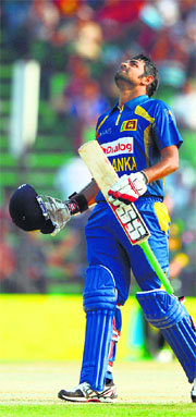 Lahiru Thirimanne celebrates scoring a century during the opening match between Pakistan and Sri Lanka at the Khan Shaheb Osman Ali Stadium in Fatullah. 