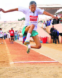 An elderly woman in action during the 35th National Masters Athletics Championship in Coimbatore