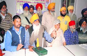 Members of 1984 Sikh Riot Victims' Sangharsh Committee address mediapersons  in Amritsar  on Wednesday