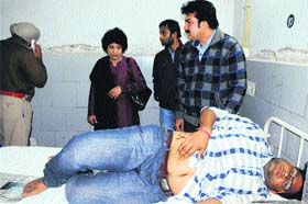 Dr Sujata Sharma, Principal, Government Medical College, along with police officials interacts with a medical student admitted to Guru Nanak Dev Hospital