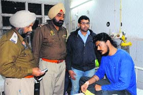Police officials interact with a medical student