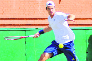 A player returns a shot during the DLF-ITF Men's Futures $10,000 Tennis Tournament at the CLTA courts, Sector 10, in Chandigarh on Wednesday.