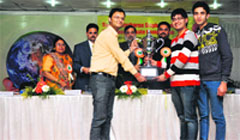 Lovely Professional University students with the trophy at Sardar Bhagwan Singh Institute of Bio-Medical Sciences at Balawala, near Dehradun, on Wednesday. A Tribune photograph 