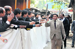 Lawyers contesting for various posts in the Bar Association elections campaign outside a polling booth in Dehradun on Wednesday. A Tribune photograph