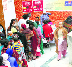 Patients stand in a queue at the Roko Cancer camp in Ludhiana on Wednesday.