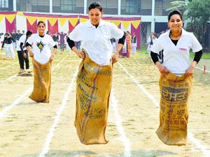 Students take part in a sack race during the annual athletics meet at Ramgarhia Girls College, MIller Ganj, Ludhiana, on Wednesday.