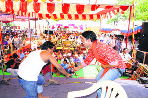 Artistes stage a play during a programme under the de-addiction drive of the BSF in Amritsar.