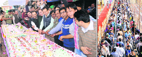 Residents cut a 2,100 pound cake; and (right) devotees throng Shivala Bhag Bhaiyan Temple on the occasion of Mahashivratri in Amritsar on Thursday.