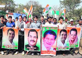 Congress workers hold a rally in support of Cabinet Minister Harak Singh Rawat in Haridwar on Thursday